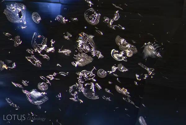 Guide to Blue Sapphire: History, Properties, and Investment heat treated sapphire bubbly fingerprints inclusion